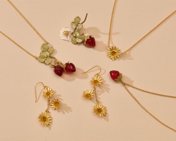 Jewellery inspired by nature Earrings, necklaces and brooches with summer floral and fruit motifs.