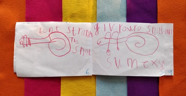 Childs drawing of a snail on a brightly coloured striped background