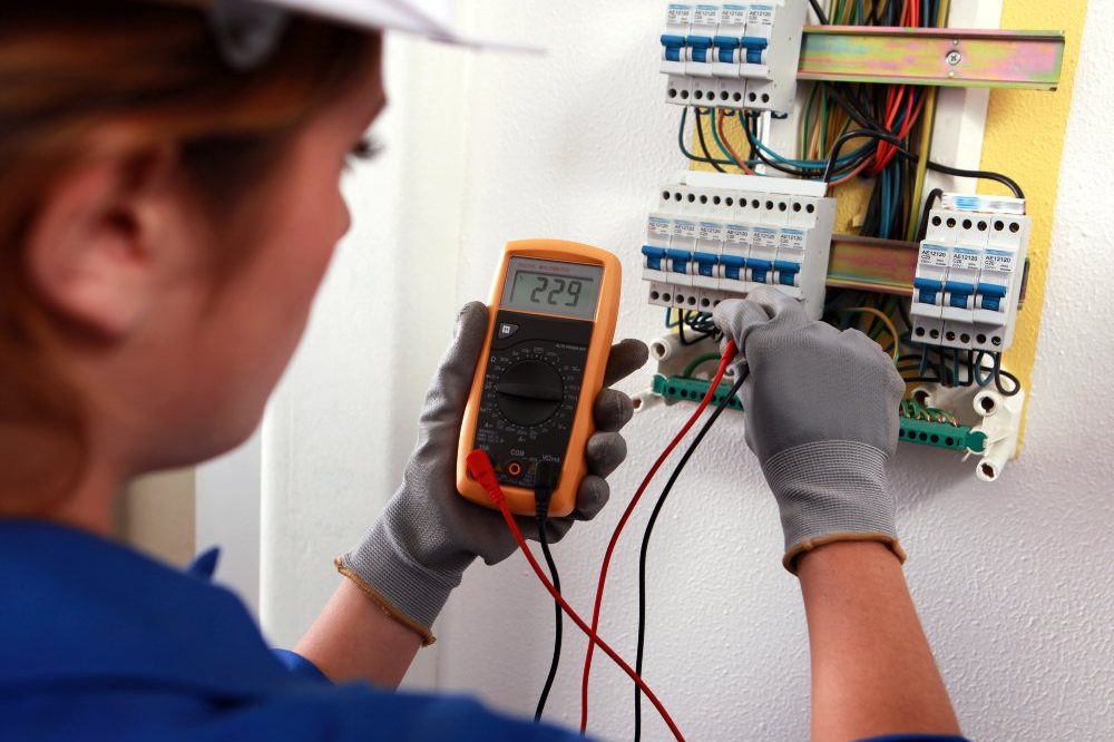 Woman Undertaking Electrical Testing