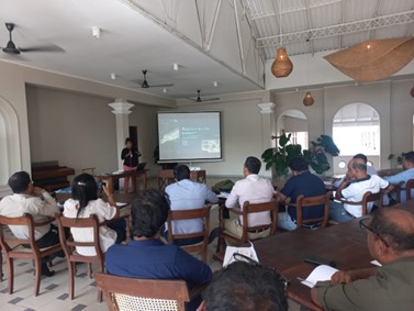 A presenter talking to a group of people at the oiled wildlife response training