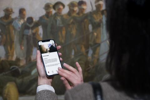 A visitor uses the Bloomberg Connects App