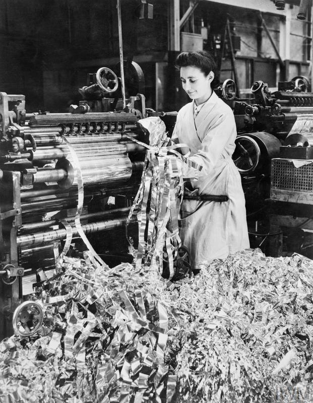 A factory worker producing the strips of aluminium foil for 'Window'