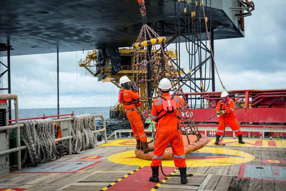 Group Of People Offshore Rigging