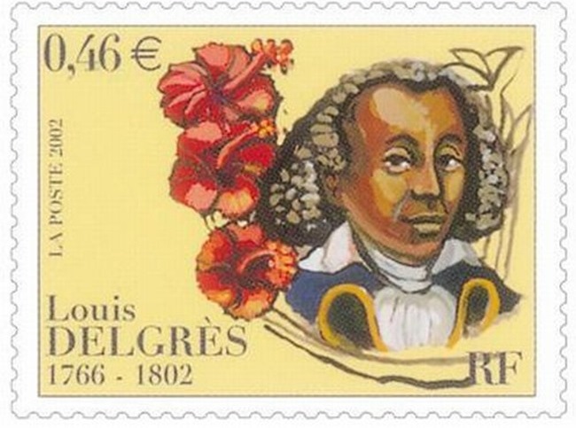 Postage stamp with bust of man in wig and military uniform on right, flanked by red hibiscus flowers, on a creamy yellow background.