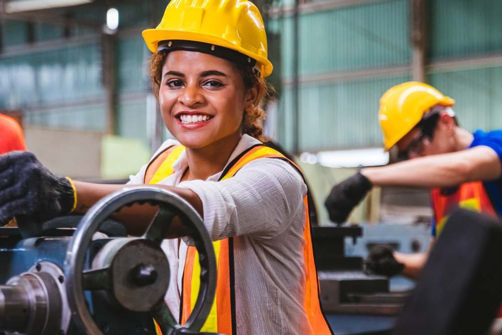 Woman In Yellow Hard Hat And Orange PPE