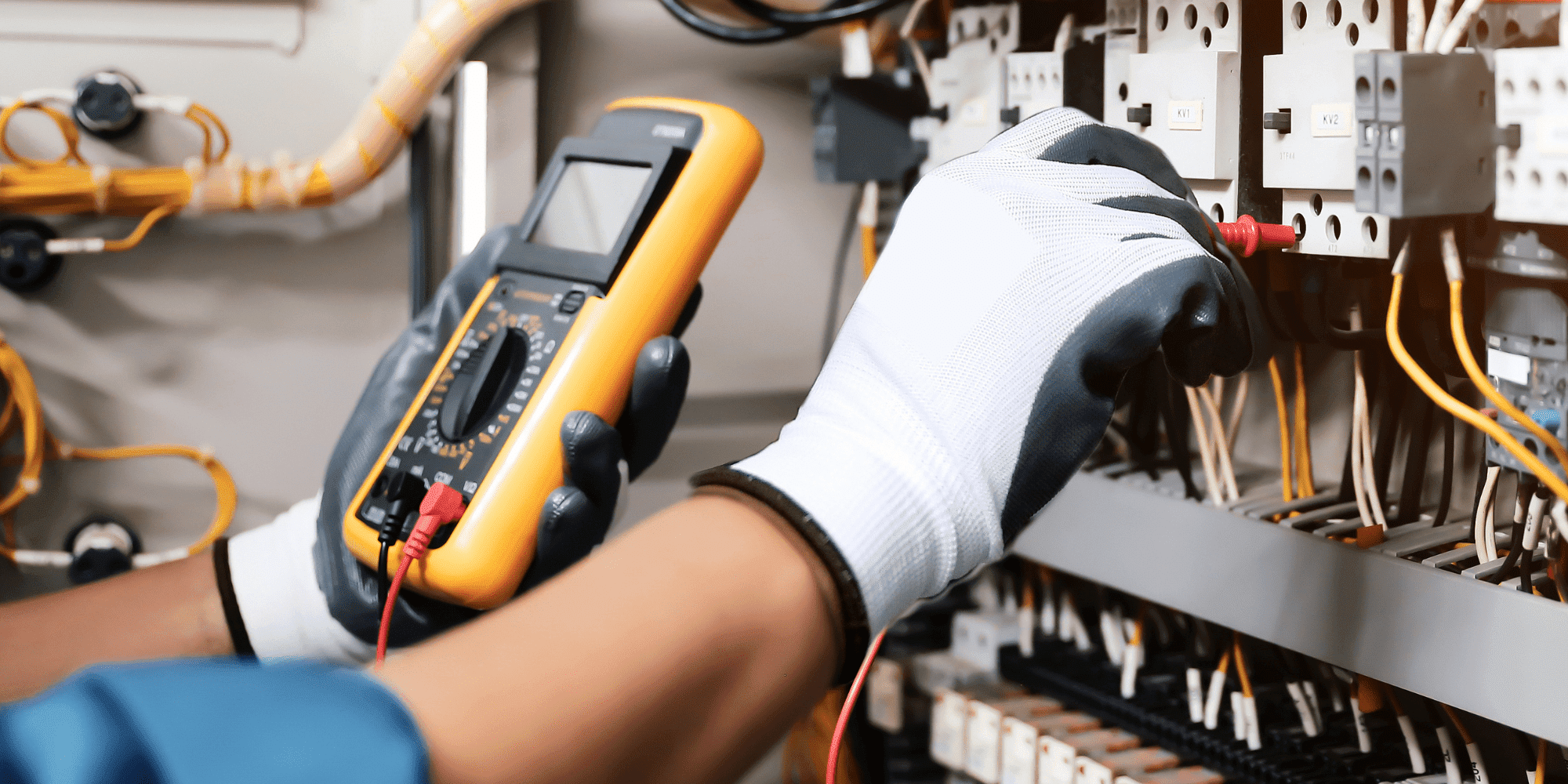 Electrical Person Wearing Safety Gloves Testing Wires