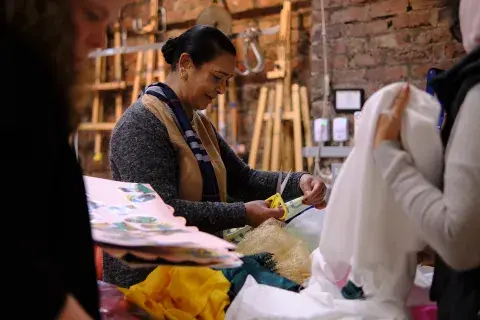 Two members of the 'Desi Grannies' creating artwork for the 'Outrageous Women' exhbition.