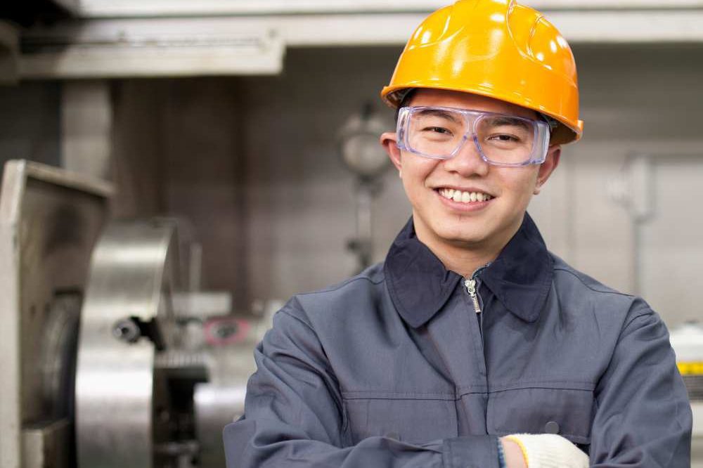 Man Smiling In Yellow Hard Hat