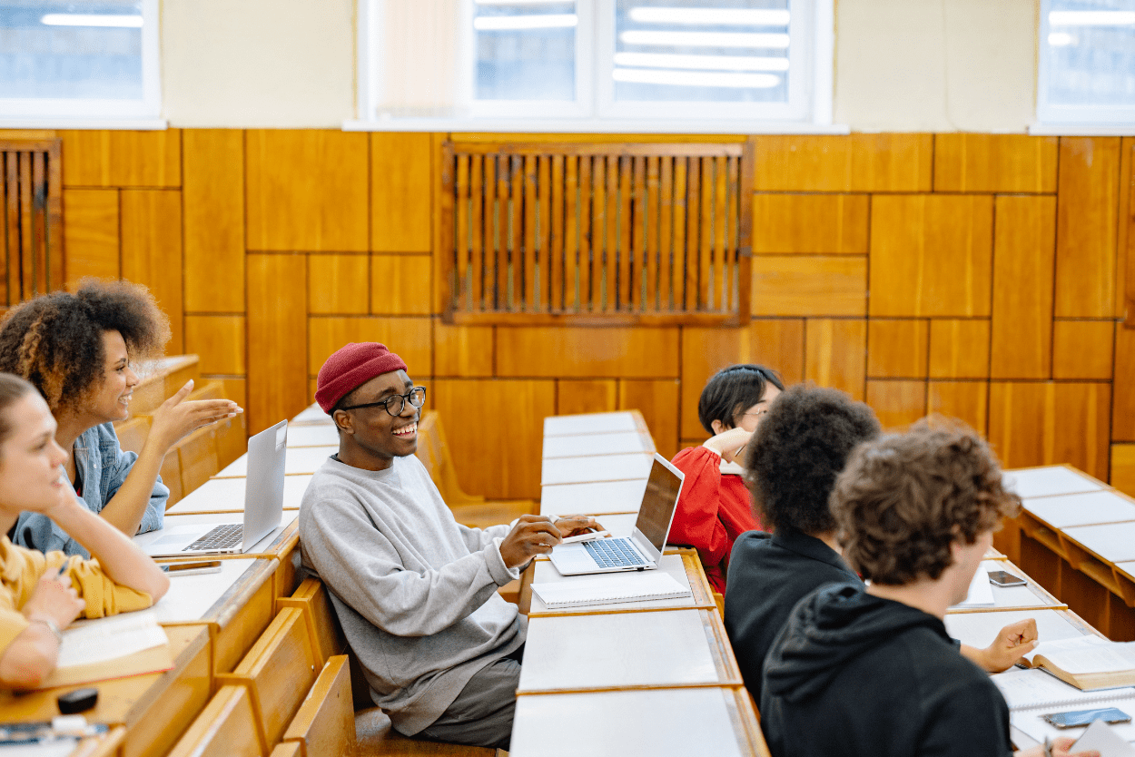 University students in a lecture theatre working