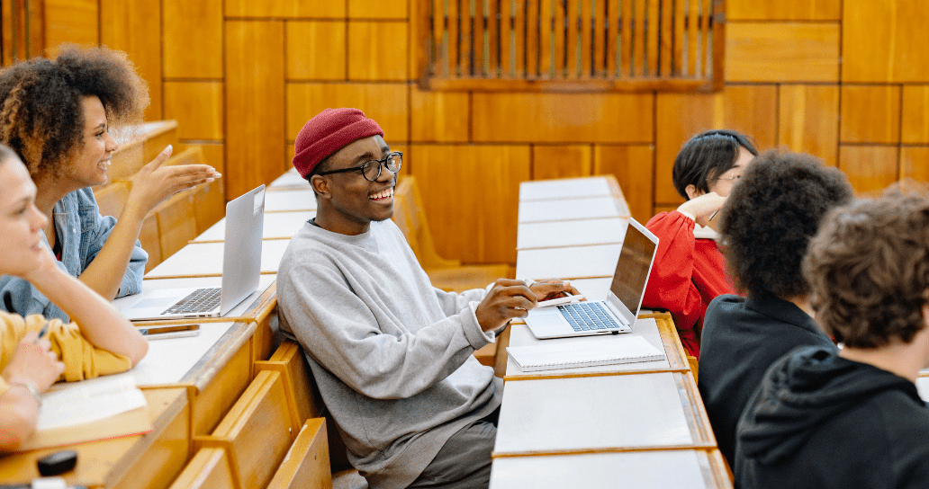 University students in a lecture theatre working