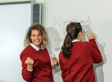 Two students at whiteboard