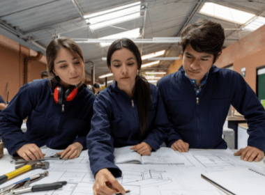Three students designing and draughting