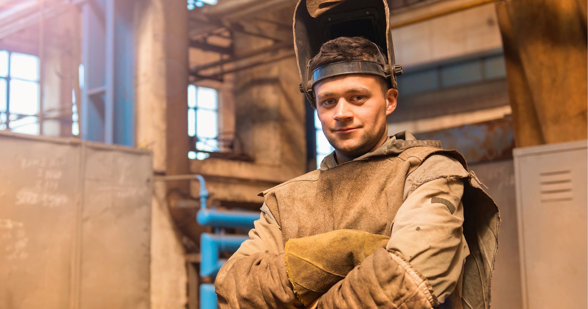 Welder with arms crossed