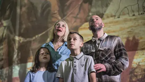 Visitors marveling at the Big Picture Show at IWM North