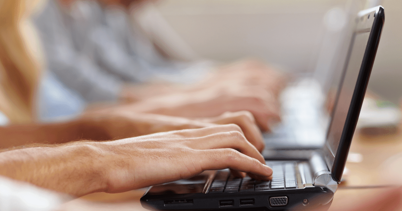 Man Working At A Black Laptop