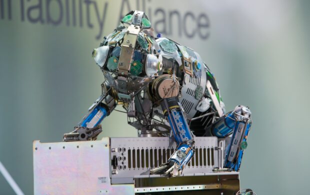 A sculpture of a chameleon made of waste metal and electrotonic items