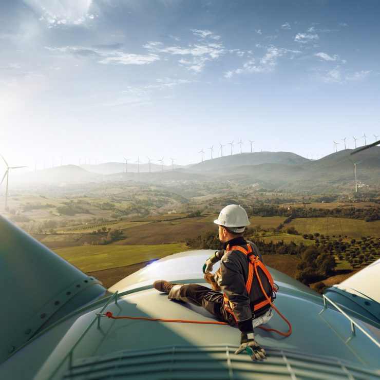 Engineer on top of a wind turbine