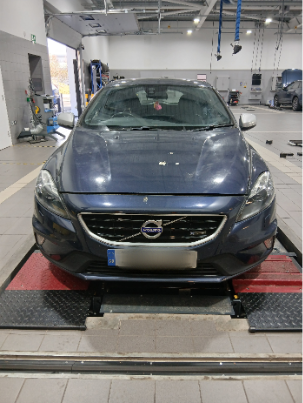 Photo of a car in a garage during an MOT test