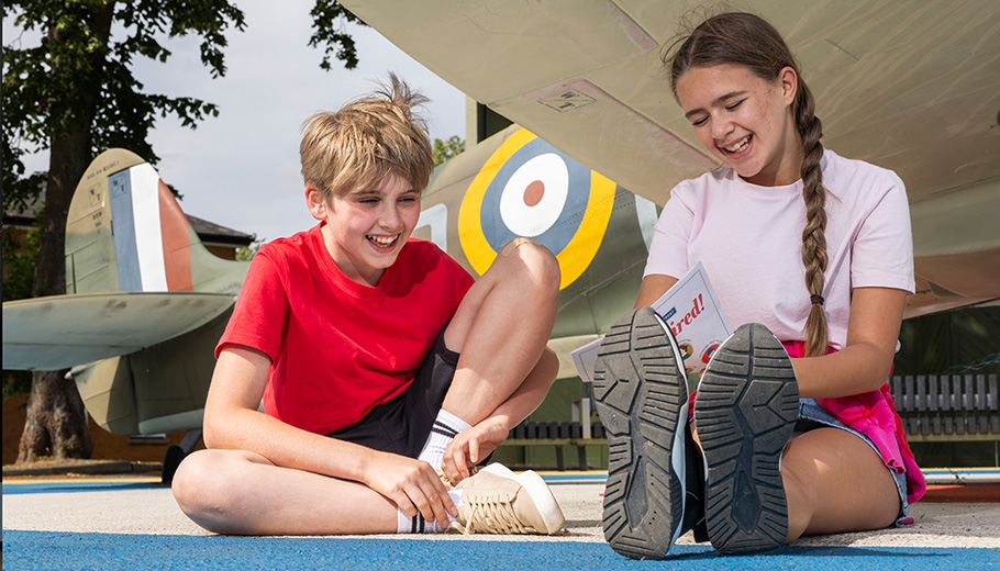 Children sitting at the Spitfire Zone, IWM Duxford