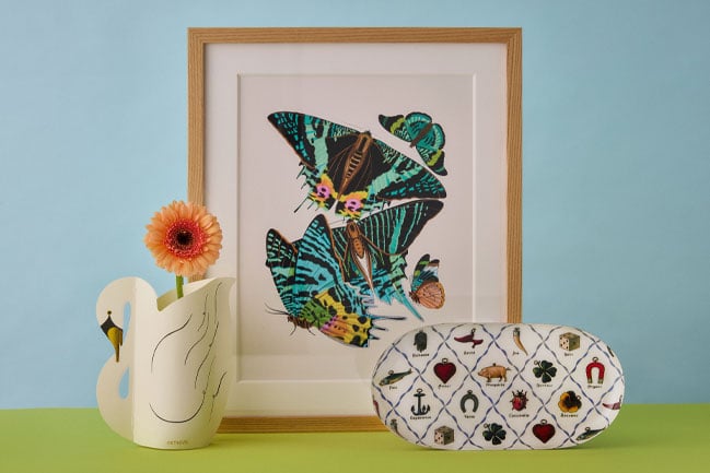 New releases: A swan-shaped flat-pack vase, a framed butterfly print and an enamel tray with pattern of lucky charms