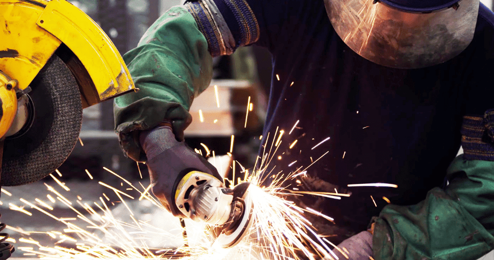 Man In PPE Working With Abrasive Wheels - find engineering training courses and ECITB courses in trade disciplines plus technical tests