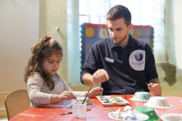 Male nursery work and child painting.