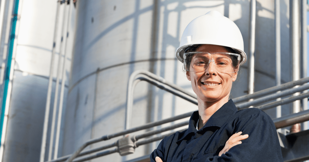 ECITB jobs enable you to help workers in industry like this woman in hard hat and safety glasses