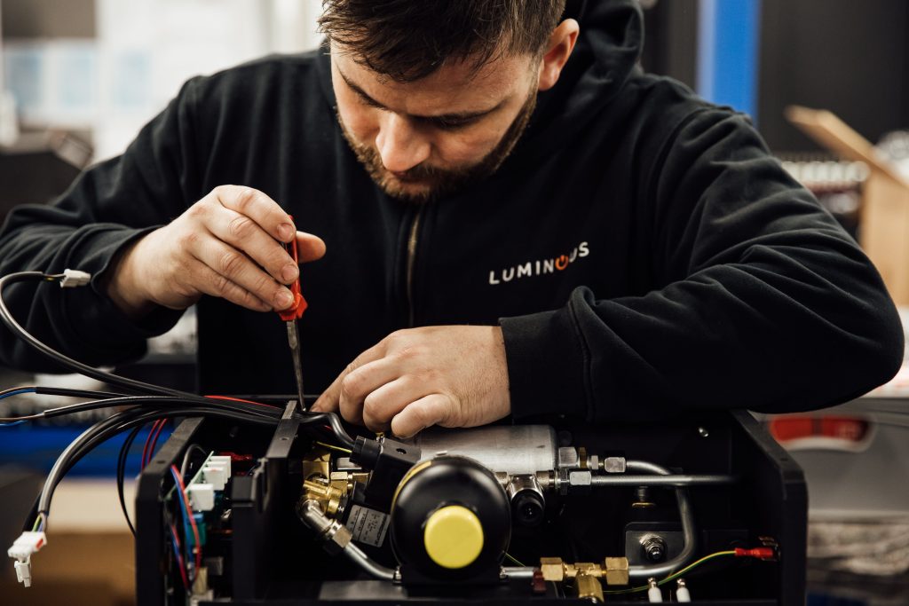 Technician Assembling Product