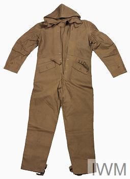 First World War period British Army 'protective' (camouflage) suit ('sealed pattern' example), complete with hood. Exhibition caption states: 'Various items of clothing were devised to protect the soldier while out on patrol. They were coloured brown or white to blend in with the mud or snow of No Man's Land. This example is a Royal Army Clothing Department sealed pattern approved in 1917'.
