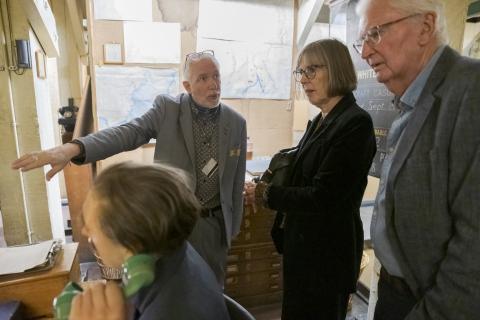 A couple having a private tour in the Map Room at Churchill War Rooms