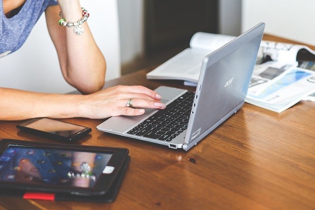 Woman working on her laptop at a desk