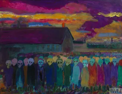 Groups of Belsen prisoners stand in front of building, painted in purple, gold and turquoise colours. 