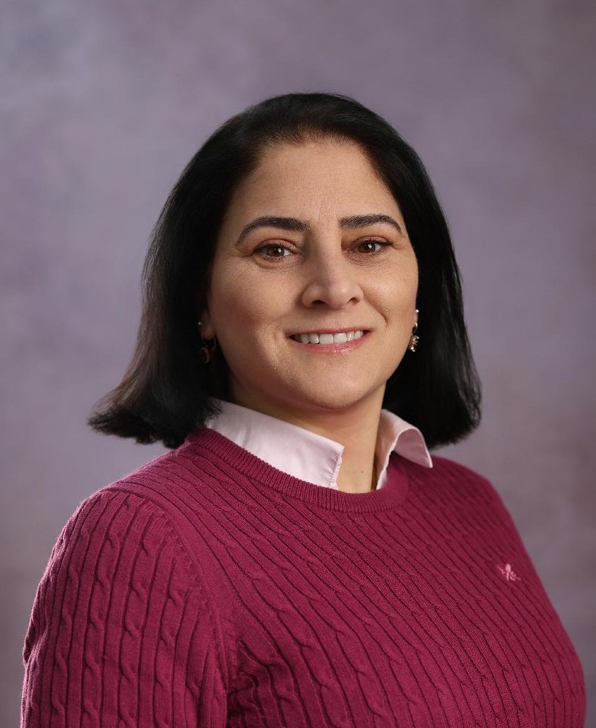 A woman smiling at the camera