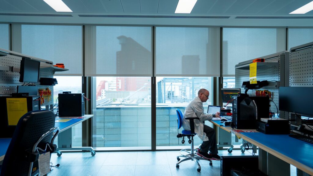Image of a HMRC employee working in a digital forensics laboratory