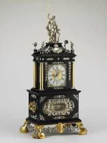 An ornate blue, silver and gold carriage clock