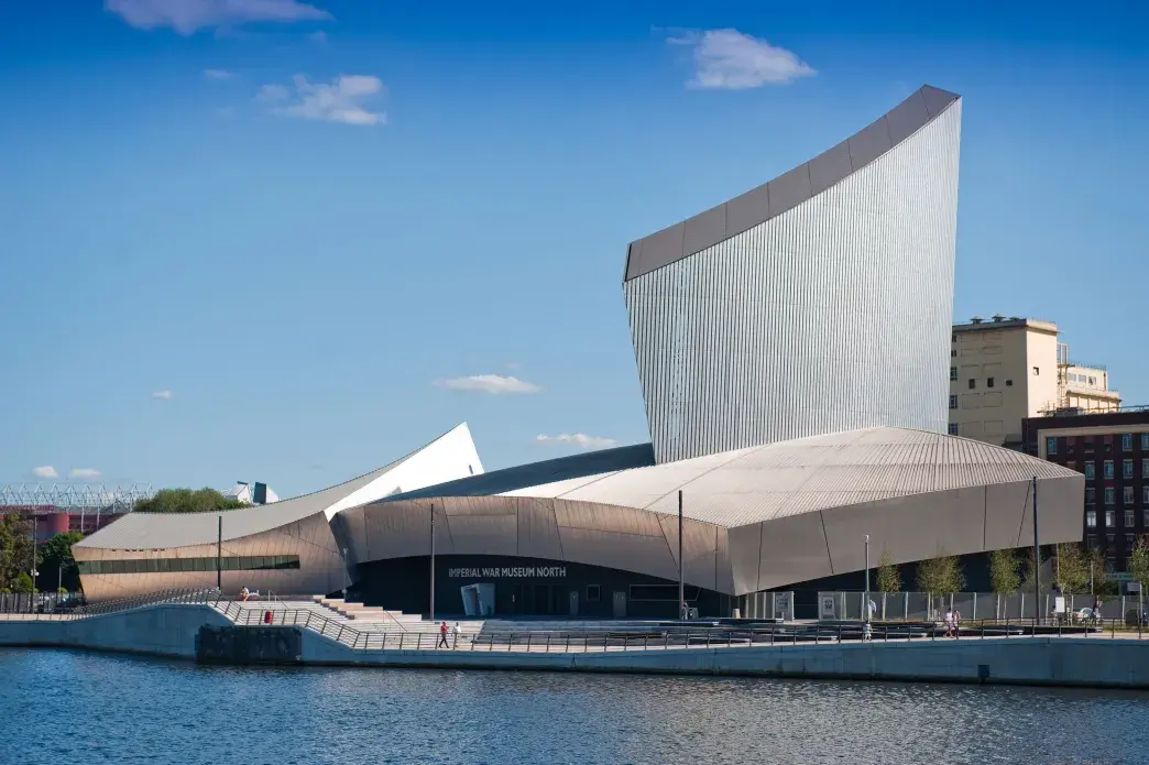 External show of IWM North's aluminium clad building overlooking the waterfront.