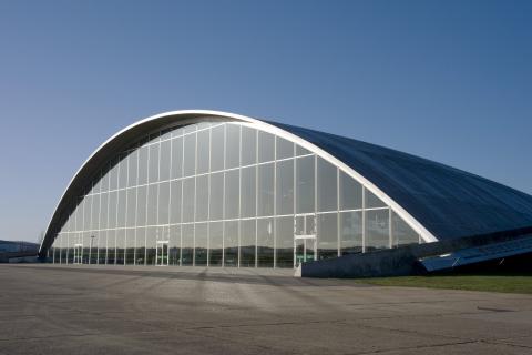 Exterior shot of glass domed American Air Museum building at IWM Duxford.