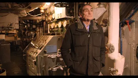 IWM Conservation Manager, Andy Curran, stands in the Boiler Room of HMS Belfast for the documentary.