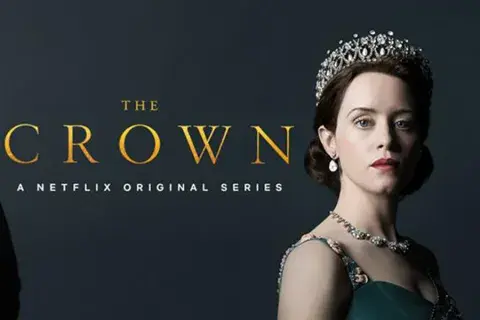 Advert for the Crown on Netflix showing actor of Queen Elizabeth II wearing crown on dark blue background. 