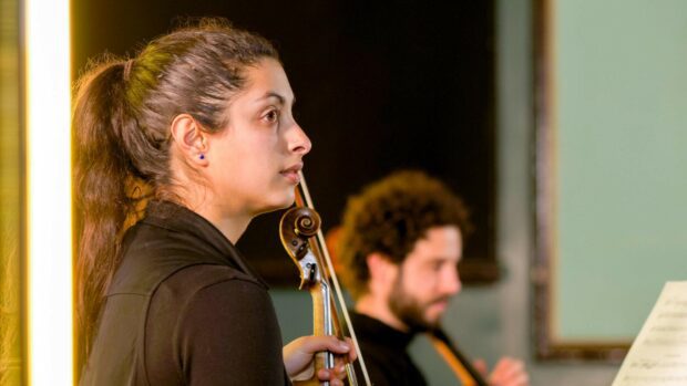 Two classical musicians with stringed instruments performing as part of a WIILMA lockdown concert