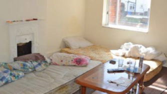 Empty bedroom with a mattress on the floor