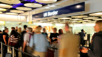 UK border sign in busy airport