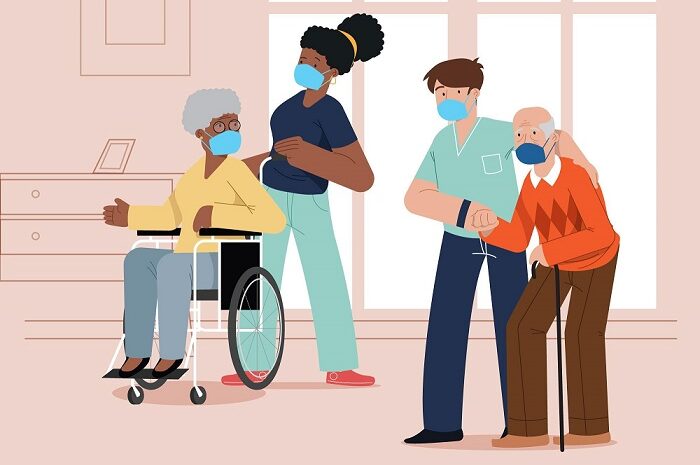 Care workers with residents in care home