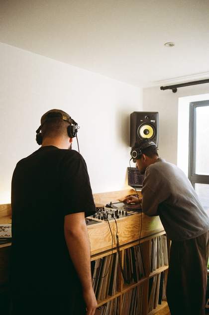Two people DJing