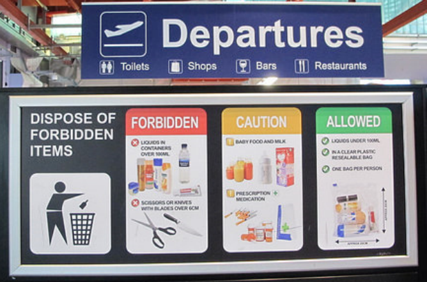Security information poster in airport departure lounge