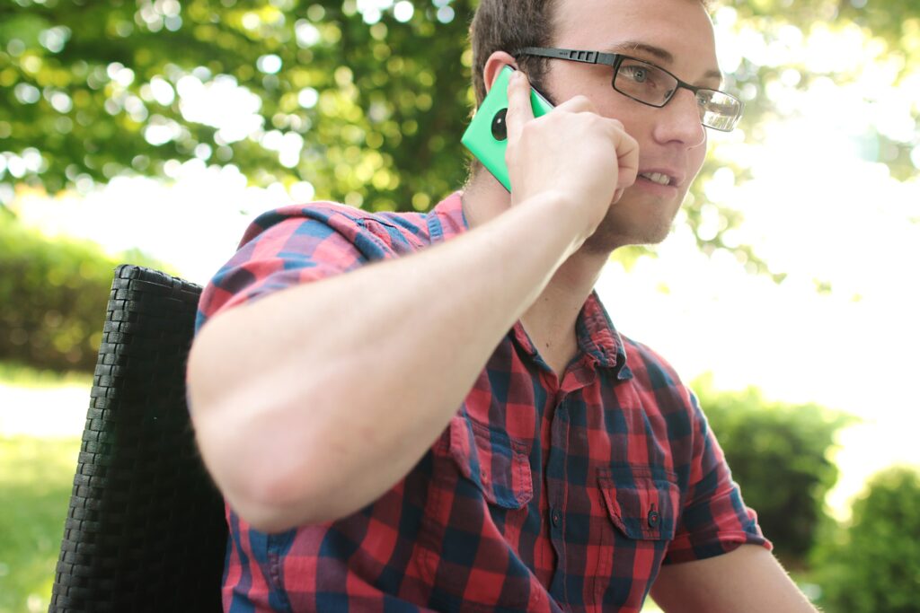 Image of a man holding a mobile to his ear