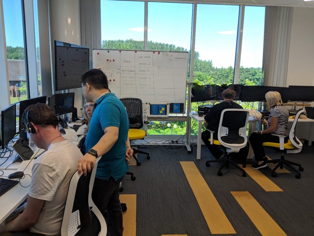 The assistive technology team at work at their desks in the office