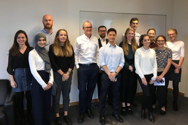 Sir Patrick Vallance poses for a group photo with interns