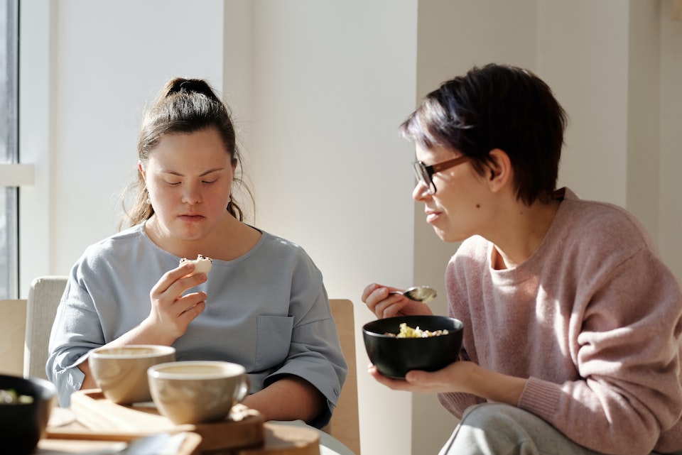 A woman carer with a disabled child