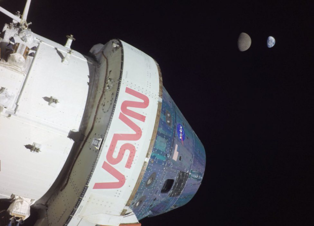 The Orion capsule, our moon and Earth floating in space. Credit: NASA.